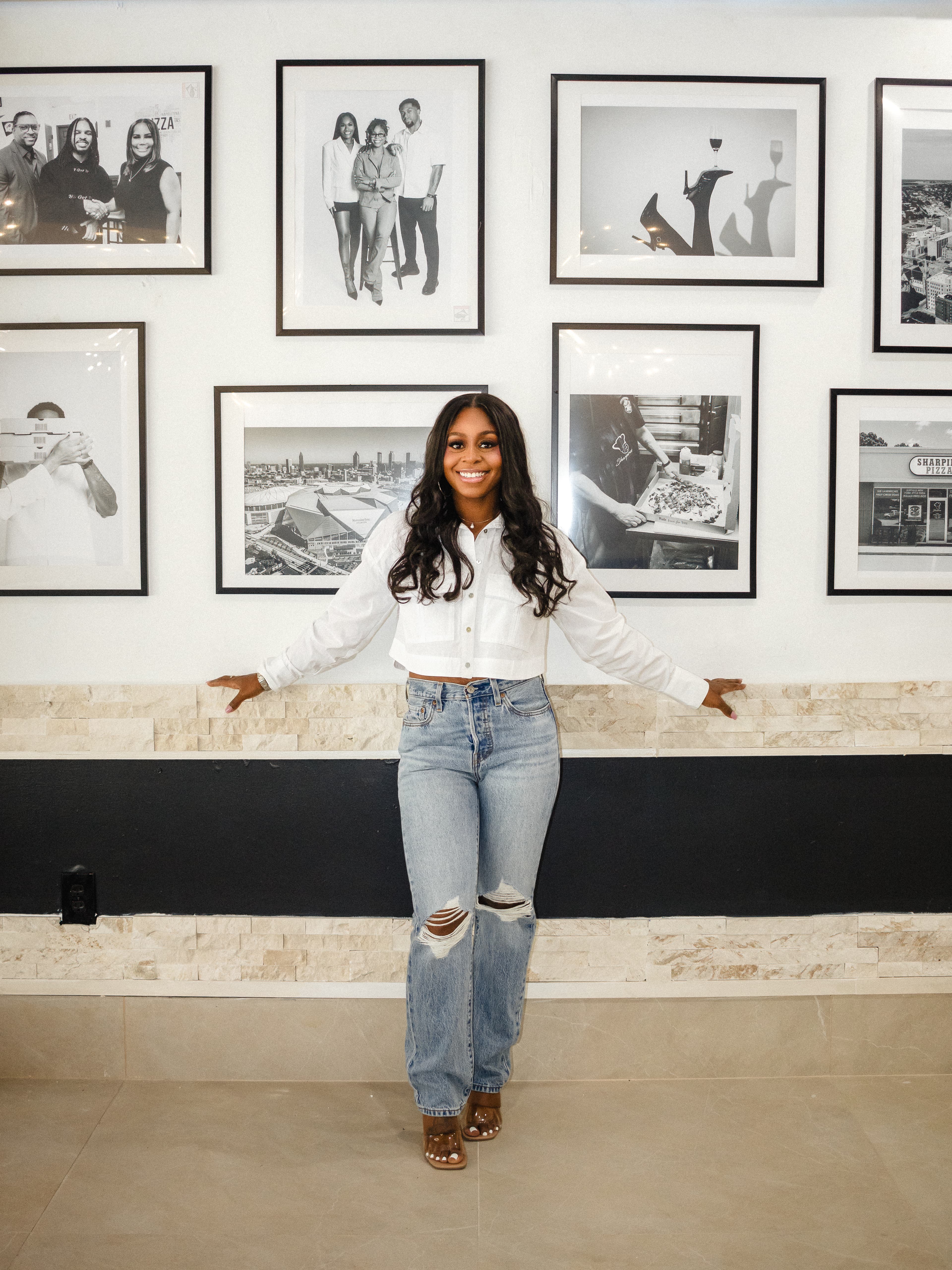Portrait session in front of framed Atlanta wall art