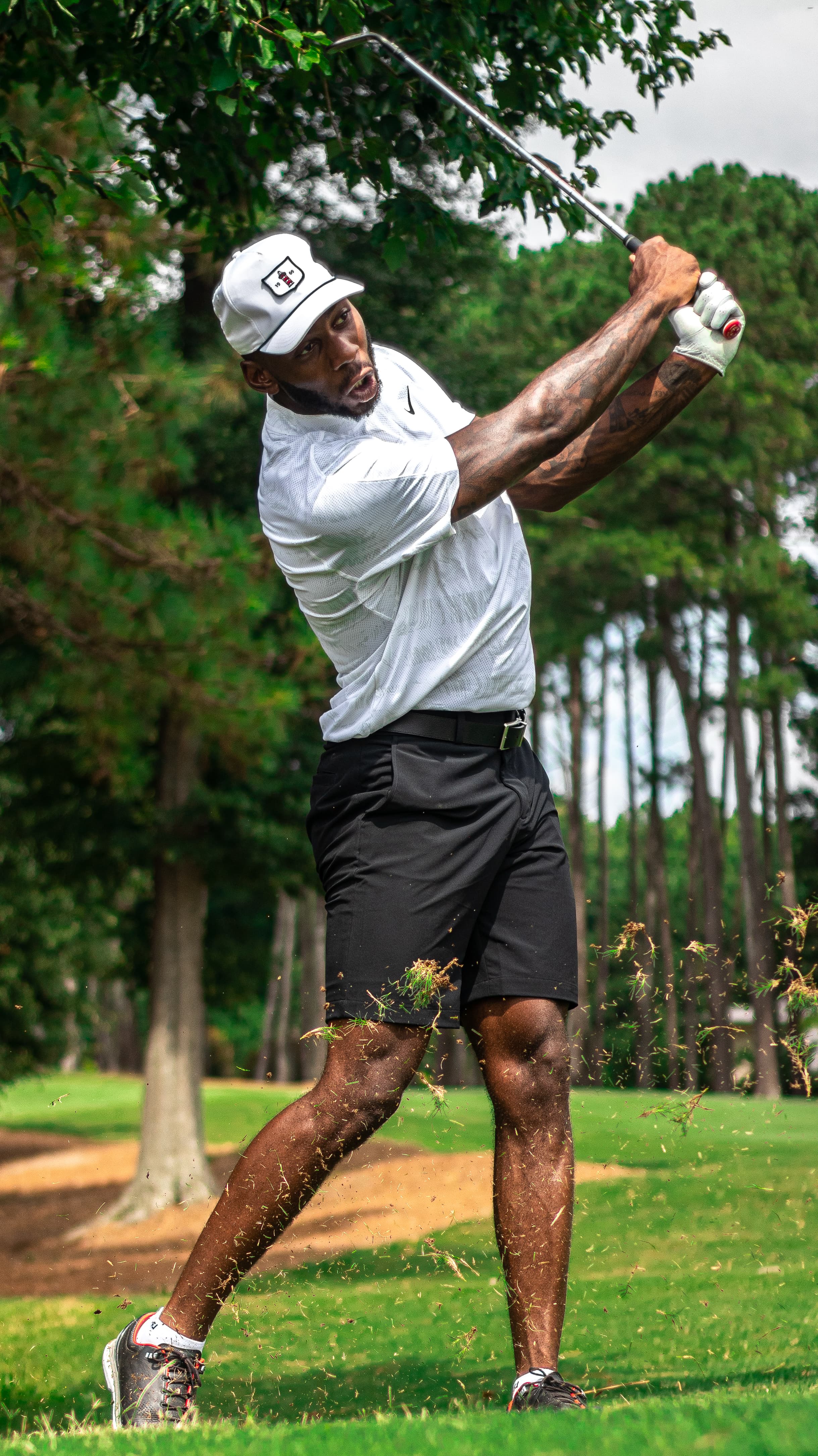 Lifestyle golf action photo captured mid swing